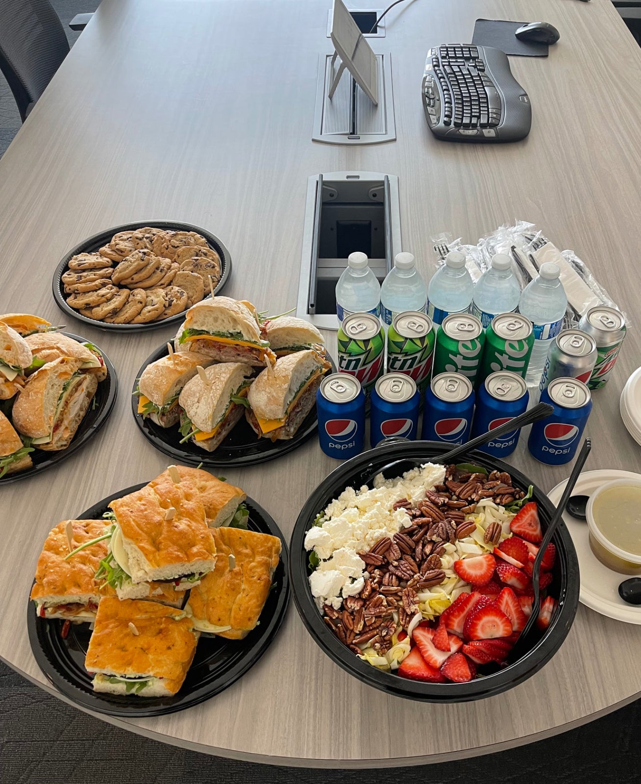 Shef Madres corporate catering lunch meeting with salads and sandwiches in boardroom